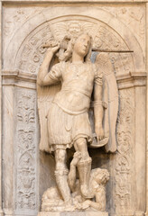 Fototapeta na wymiar NAPLES, ITALY - APRIL 21, 2023: The marble relief of Michael Archangel in the church Basilica di San Pietro ad Aram by Bartolom Ordonez from 16. cent.