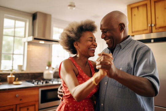 Authentic moment of an African American retired couple sharing a dance in the kitchen, an embodiment of enduring love and romance, generative ai