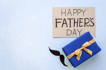Blue gift box for Happy Fathers day. Flatlay for greeting card