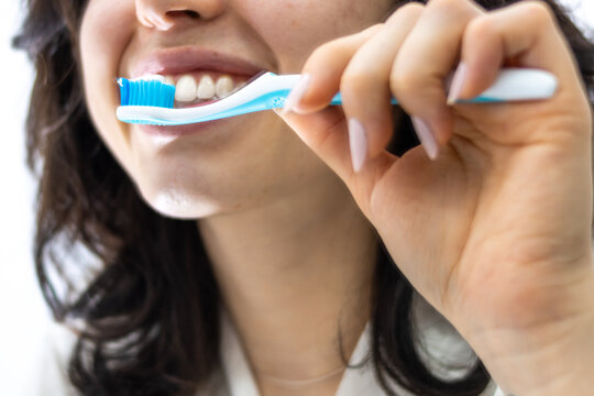 portrait of a young unrecognizable latin girl brushing her teeth in the bathroom at home. Carrying out an oral hygiene routine is very important for our health.