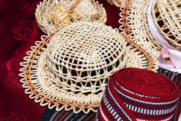 Summer straw hat on table with handmade items, rustic style