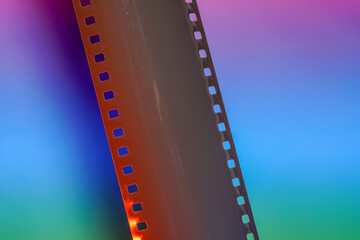 Fototapeta premium Film of an analogue camera with colorful background photographed