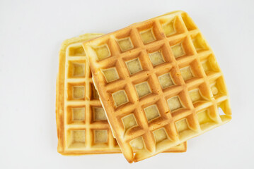 Square Belgian waffles on a white background.
