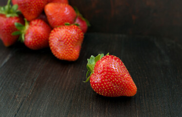 fresh organic strawberries on a wooden table