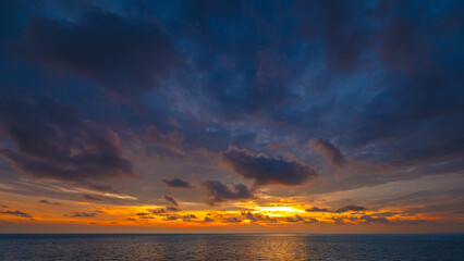 Wide angle shot of beautiful sunset on tropical sea at summer time from tilt-shift lens in full HD ratio