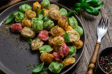 colorful dumplings in a bowl with sauce