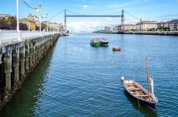 Panoramic of the Vizcaya suspension bridge with small boats anchored nearby