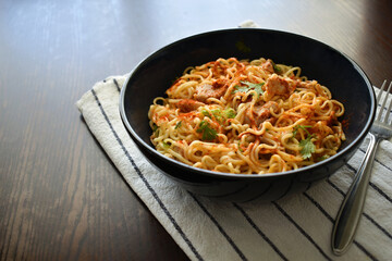 Spicy noodles with pork salad in a bowl.  
