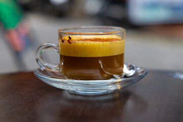 Traditional Egg Coffee on Street of Hanoi Old Quarters Vietnam. The coffee flavours and texture is...