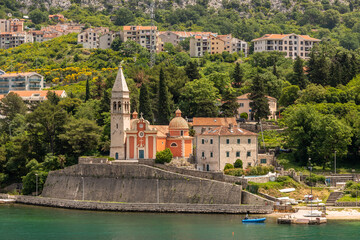 Landscape Exposure done from a cruise ship, showing the sea entrance to Kotor bay and its beautiful coastal landscapes and small villages , on a sunshiny day.