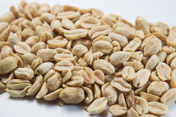 Peanuts on a white background. Salty beer snack