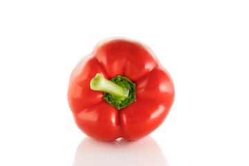 Red sweet bell pepper isolated on white background. One sweet bell pepper. Close-up