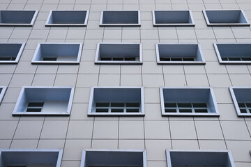 the arrangement of building windows in the background