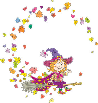 Happy little witch with a big hat and a cloak with stars flying on her magic broom through falling and swirling autumn leaves, vector cartoon illustration isolated on a white background