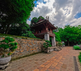 Literature Temple surrounded by beautiful gardens old historic buildings Bonsai plants and old trees in Hanoi Vietnam 