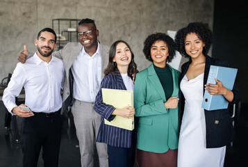Five Young Multicultural Businessmen And Businesswomen Standing In Modern Office