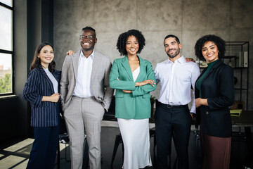 Five Multiethnic Businessmen And Businesswomen Coworkers Posing Standing In Office