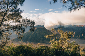 Landscape view of misty mount Bromo volcano. Foggy morning in the java national park with mount...