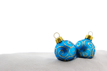 Blue christmas baubles on the sandy beach isolated png file
