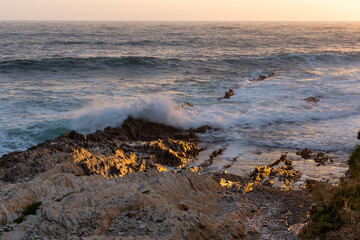 Waves along the coastline at sunset in Montana de Oro State Park