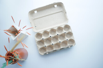 egg carton without eggs on table ,