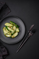 Delicious juicy cucumber cut into large slices with salt, spices and french mustard