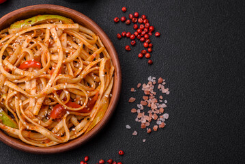 Delicious asian udon dish with vegetables, mushrooms, salt and spices