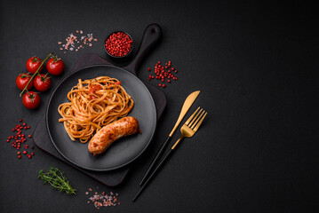 Delicious juicy grilled sausage with pasta or noodles with salt, spices and herbs