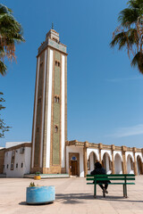 Lebanon mosque in downtown Agadir with a rich decorated tower and green fresco, Morocco