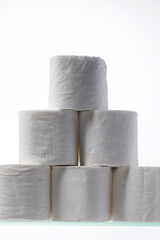 A mountain of toilet paper on a glass shelf. Hygiene.
