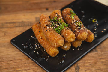Delicious cheese sticks split in half and dipped in ranch dip.




