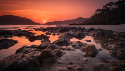 Tranquil sunset over rocky coastline, reflecting beauty in nature's waters. generated by AI