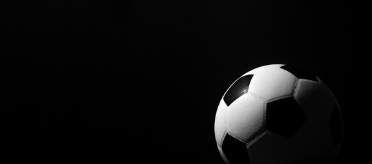 Fototapeta na wymiar Soccer ball detail on black background. Horizontal sport theme poster, greeting cards, headers, website and app.