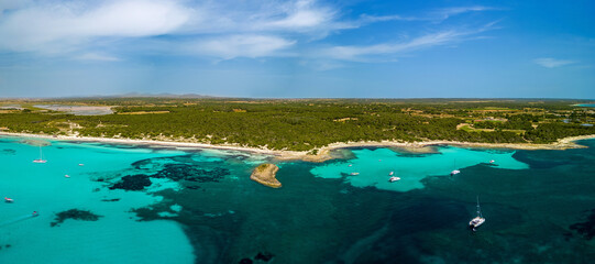 Aerial panorama image of a bay, Beach Es Tranc at the Island of Mallorca, tropical feeling with blue water and palm trees, travel destination, beautiful sand and summer vibes