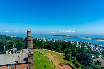 Fototapeta premium The Twin Lighthouse in New Jersey, USA, stand as iconic maritime beacons. This historic landmark adorn the coastal landscape, offering scenic views of the Atlantic Ocean. 