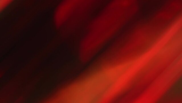 Green red and yellow retro diagonal lights glowing on a black background. Abstract animation motion design with beautiful flying luminous stripes lines