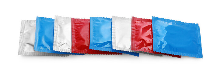 Condom packages isolated on white. Safe sex