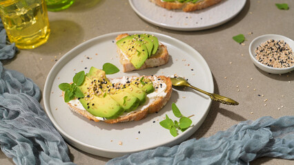 Toast with avocado cream cheese and wheat bread