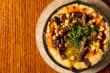 Queso fundido with beef and spicy salsa