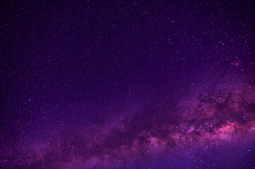 purple night sky,half, part milky way and star on dark background.Universe filled with stars, nebula and galaxy with noise and grain.Photo by long exposure and select white balance.