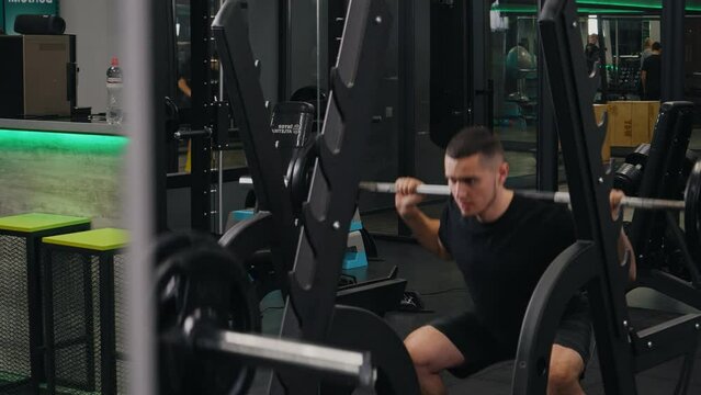 Weighted squats, strength training, mindful exercise. Executing barbell squats with weights resting on neck, bodybuilder exemplifies strong masculine spirit while prioritizing health-centric lifestyle