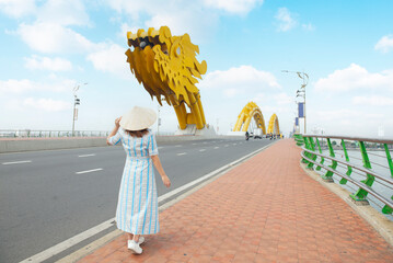 Tourist woman is enjoy traveling and sightseeing at Dragon bridge which is one of the most...