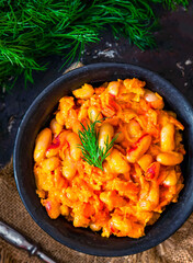 Stewed white beans with carrot in tomato sauce