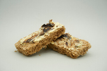 Weet-bix with Butter and Vegemite a healthy Children's Snack on a off-white background