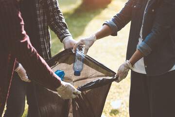 A team of volunteers helped collect rubbish in black bags. Grab a water bottle, a plastic bag, and a Styrofoam box. clean the area environmental protection Reduce heat illness, save the world concept