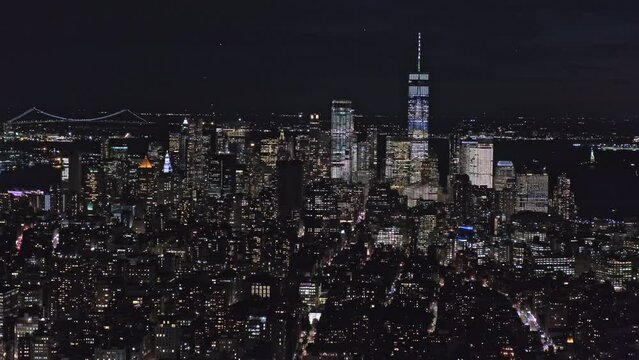 Lower Manhattan night skyline view with glittering skyscrapers, New York, USA