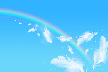 青空にかかる虹と羽根