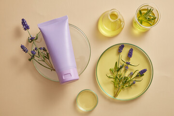 A purple tube placed on podium, displayed with laboratory glassware filled with yellow fluid and purple lavender flowers. Lavender (Lavandula) essential oil can protect your nervous system