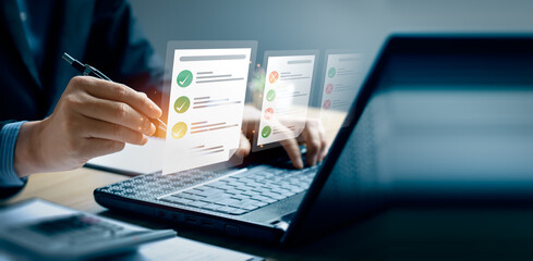 Business performance checklist, businessman using laptop doing online checklist survey, Check marks...