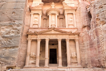 View of Al-Khazneh (The Treasury), one of the most elaborate temples in Petra, an ancient city of the Nabatean Kingdom, in Jordan. This structure was carved out of a sandstone rock face